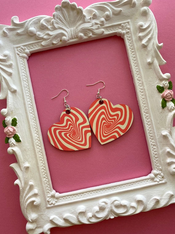 Groovy orange cream swirl white orange heart shaped earrings