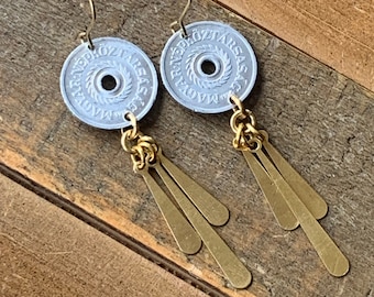 May include: Silver coin earrings with gold chain and tassel accents. The coins feature Hungarian text.