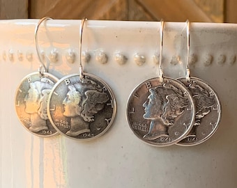 May include: A pair of silver-toned dangle earrings featuring authentic 1942 Mercury dimes as the primary charms. Each coin displays the profile of Liberty wearing a winged cap, with the text LIBERTY, IN GOD WE TRUST, and the year 1942 visible.