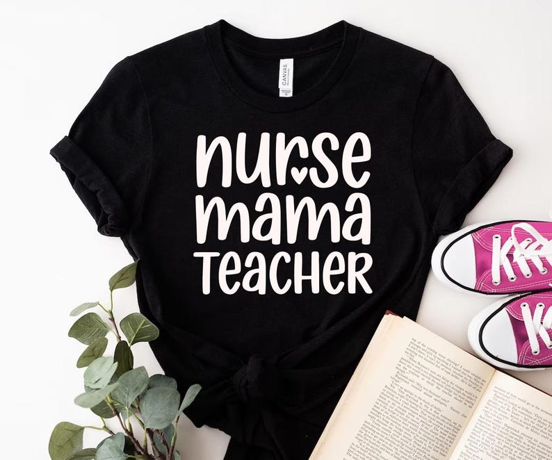 May include: Black t-shirt with the words "nurse mama teacher" in white, with a heart replacing the letter "o" in "nurse". The shirt is paired with pink sneakers and an open book.