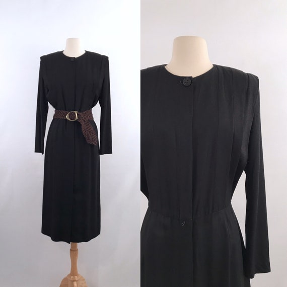 female CEO black dress | 80s vintage
