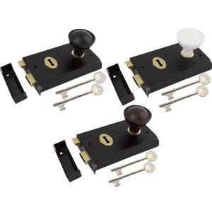May include: Three black door latches with brass detailing, each with a different knob colour: black, white, and brown. Each latch includes two keys and a strike plate. Suitable for home security and vintage decor.