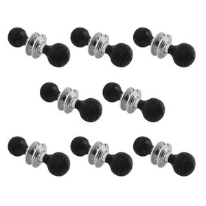 May include: Eight black door knobs with a ribbed, spherical handle. Each knob has a polished silver-coloured base and mounting hardware. The knobs are arranged in a grid pattern against a white background. These are suitable for interior doors.
