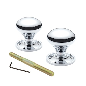 May include: Two polished chrome door knobs with a rounded design. The knobs are on a circular base, with a long screw and a small Allen key. The hardware is for installation, suitable for interior doors.
