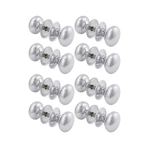 May include: Eight silver door knobs with a hammered texture. Each knob has an oval shape and is attached to a round backplate with screws. The knobs are arranged in two rows of four against a white background.