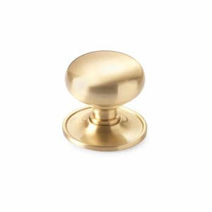 May include: A gold-coloured cabinet knob with a rounded top and a circular base. The knob has a smooth, polished finish. Suitable for drawers and cabinets, this hardware is designed for easy gripping.
