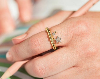 Beaded stretch ring with pave star and birthstone charm