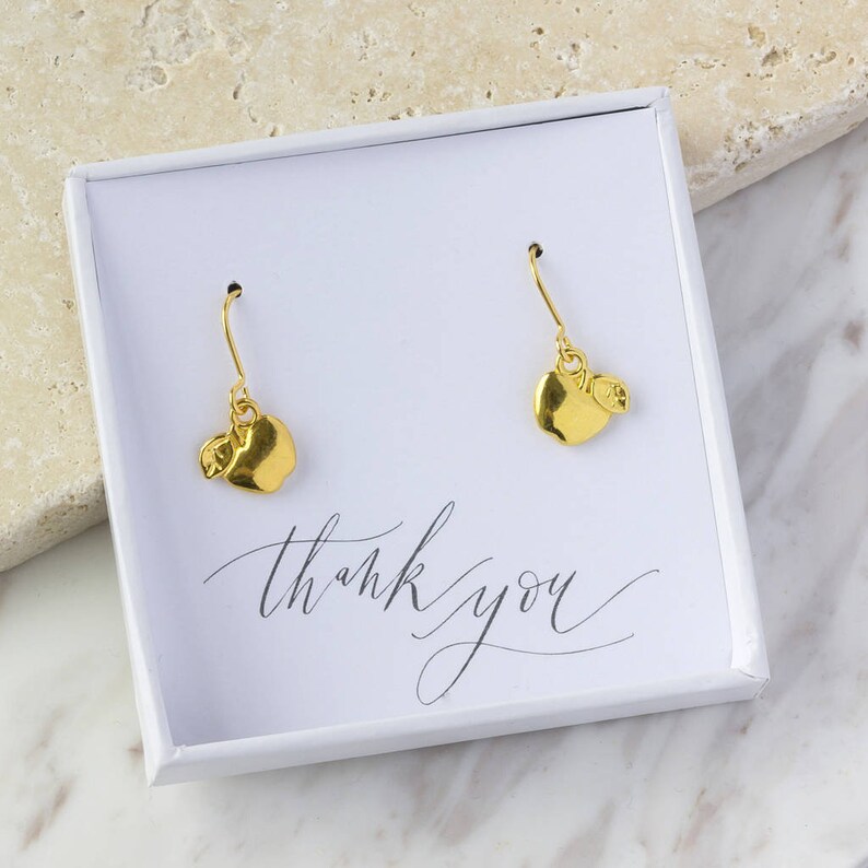 Gold apple charm earrings image 1