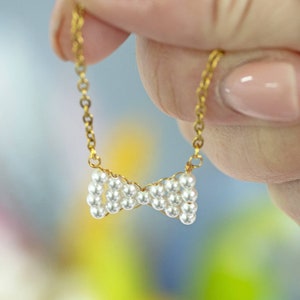 Hand beaded pearl bow necklace