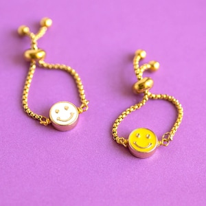 Smiley face slider chain ring