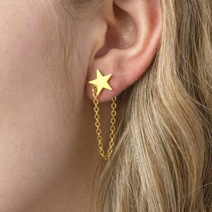 Gold plated star earrings with chain drop detail