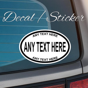May include: White oval sticker with black text that reads "ANY TEXT HERE" on a blue car window. The text is repeated on the top and bottom of the oval.