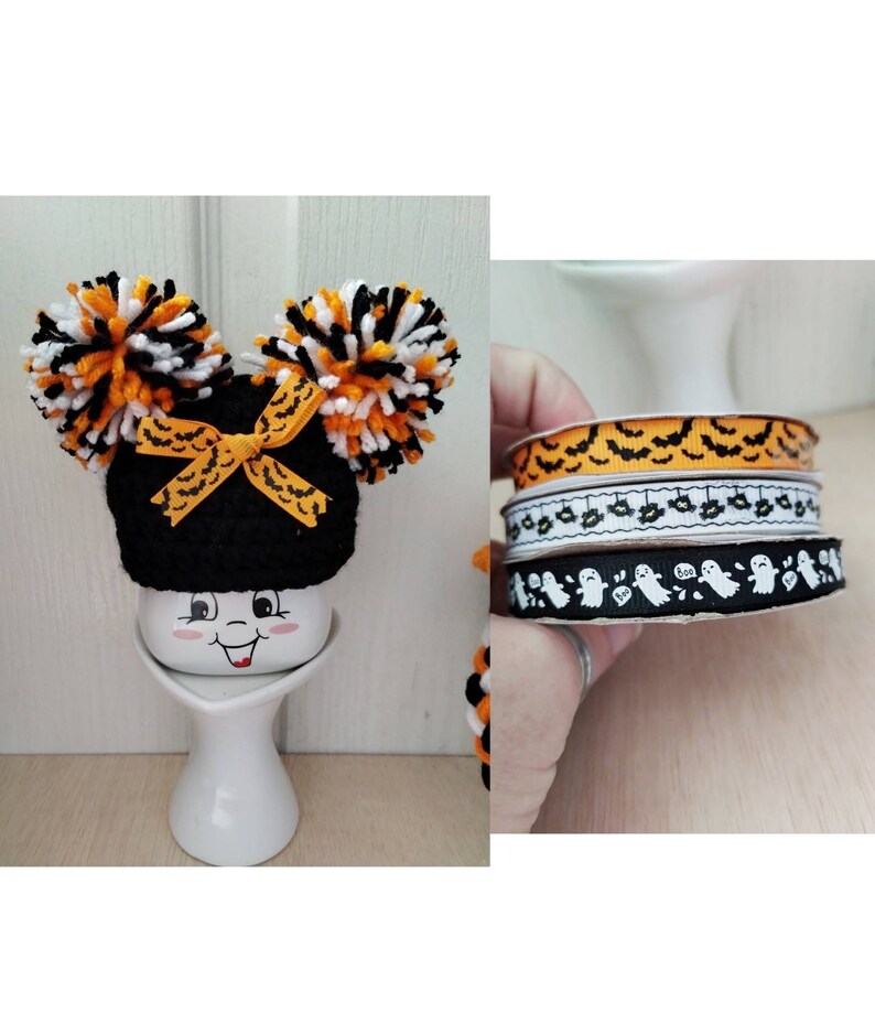 May include: Three rolls of Halloween ribbon with different patterns. The first roll has orange and black bats, the second roll has white bats and black ghosts, and the third roll has white ghosts with the word "Boo" on them.