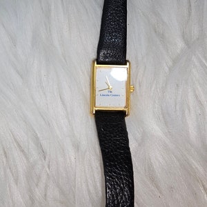 Vintage rare The LINCOLN CENTER White And Gold Watch With Black Band - Needs Battery