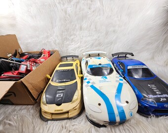 Vintage SUPER BUNDLE 3 RC Cars with huge box of Remotes, Batteries and Controllers - For Parts -