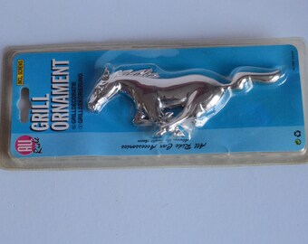 Vintage "all ride" Car grill ornament in the form of a running stallion