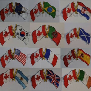 May include: A set of 12 embroidered iron-on patches featuring the Canadian flag crossed with the flags of other countries, including the United States, Brazil, South Korea, Portugal, Scotland, France, Spain, Argentina, the United Kingdom, and Ireland.