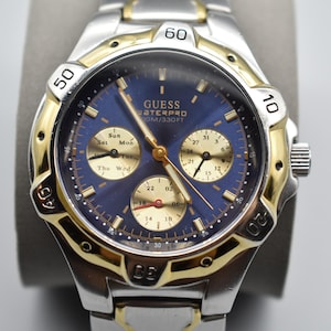 Guess Waterpro Mens Watch Rotating Bezel in Silver Tone with Gold Accents and Blue Dial New Battery