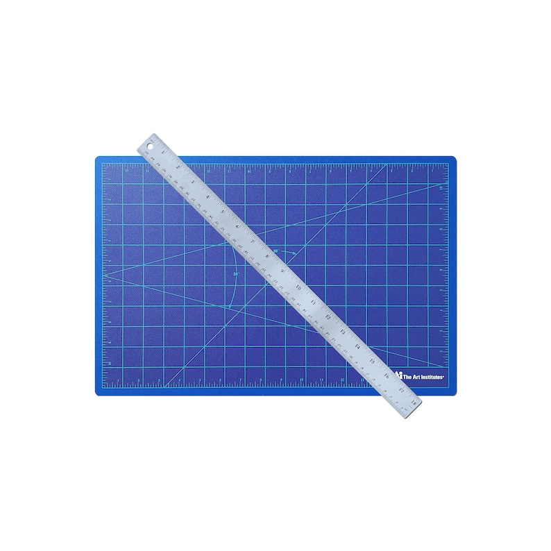 May include: A blue self-healing cutting mat with a silver ruler on top. The ruler is marked in inches and has the text "The Art Institute" printed on it.