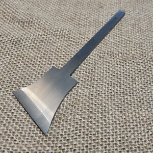 May include: A silver metal chisel with a long, thin handle and a wide, flat blade.
