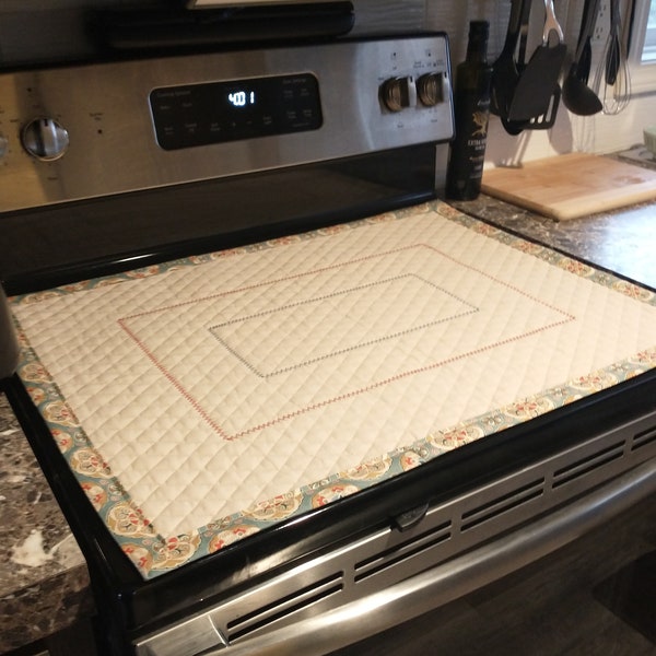 Teal Medallions Cooktop Cover. Fabric cover for flat surface glass stovetop . Padded and quilted beige and teal stove cover
