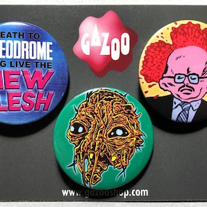 DAVID CRONENBERG - Set van 3 pin-badges (1,5&quot;/38 mm) Videodrome / The Fly / Scanners