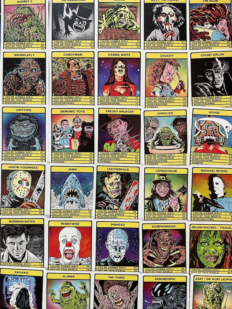 May include: A set of 25 trading cards featuring illustrations of horror movie characters. Each card has a different character, including Freddy Krueger, Jason Voorhees, Pennywise, and Michael Myers. The cards are colourful and feature a variety of styles.