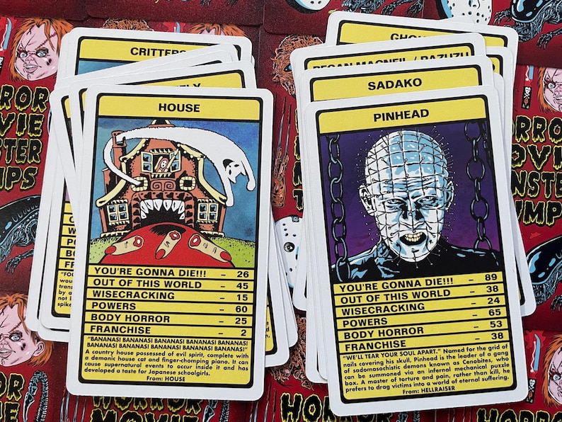 May include: A set of 10 horror movie trading cards featuring characters from popular films such as "House", "Hellraiser", "Critters", and "Sadako". Each card has a colourful illustration of the character and includes information about their powers, franchise, and how they die.