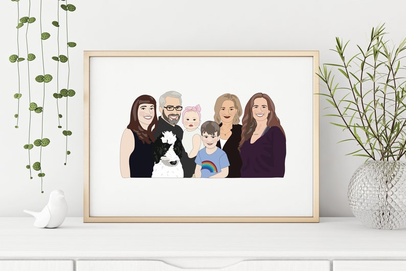 May include: A framed family portrait with six people and a dog, rendered in a minimalist style. The artwork features a gold frame and is displayed on a white surface. The family members are depicted with simplified facial features and clothing.