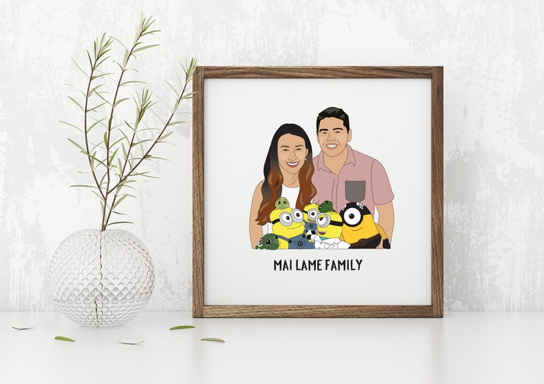 May include: A framed illustration featuring a couple and several Minion characters. The couple is smiling, and the Minions are in the foreground. The text "MAI LAME FAMILY" is at the bottom of the frame. The frame is brown.