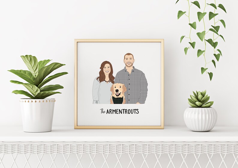 May include: A framed portrait featuring a couple and a dog, with the text "The Armentrouts" below. The artwork is in a gold frame and is displayed on a white shelf with potted plants on either side.