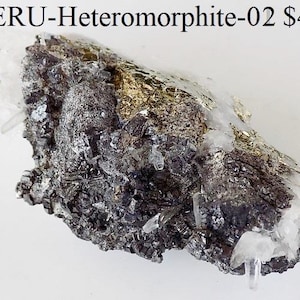 May include: A rough-hewn mineral specimen with a mix of dark gray, silver, and gold metallic elements. Clear quartz crystals are interspersed throughout the rock. The text "PERU-Heteromorphite-02" is visible at the top.
