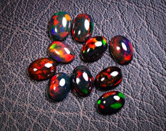 Natural Ethiopian Black Opal Cabochon Loose Gemstone 5x7mm 10Pcs Lot. Black Opal 7x5mm Oval Cabochons. 5x7mm Black opal Cabochons.