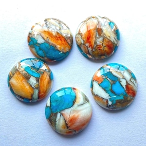 May include: Five round cabochon gemstones with a mix of turquoise, orange, and white colors. The stones have a marbled, swirled pattern.