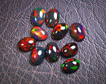 Natural Ethiopian Black Opal Cabochon Loose Gemstone 5x7mm 10Pcs Lot. Black Opal 7x5mm Oval Cabochons. 5x7mm Black opal Cabochons.