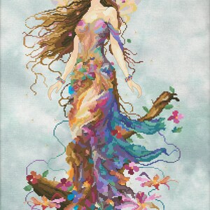 May include: A colorful fairy with long brown hair and a floral crown stands on a tree stump with flowers blooming around her. She has delicate wings and a flowing dress with a gradient of colors.