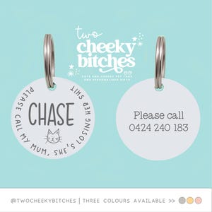 May include: Two white pet tags with silver rings. One tag has the name "CHASE" with a cat graphic and the phrase "PLEASE CALL MY MUM, SHE'S LOSING HER SHIT." The other tag says "Please call 0424 240 183."