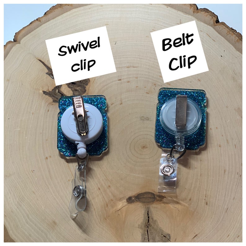 May include: Two teal blue glitter retractable badge holders with a white swivel clip and a silver belt clip. The text "Swivel clip" and "Belt Clip" are written on white paper.