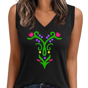 May include: Black sleeveless top with a V-neck. The shirt features a colorful floral design in green, pink, purple, and yellow. The graphic is symmetrical and centered on the front of the shirt. The top is paired with blue jeans.
