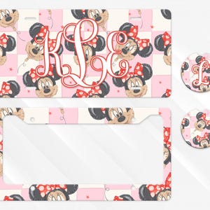 May include: A rectangular number plate, a number plate surround, and two circular car coasters featuring a repeating pattern of Minnie Mouse balloon heads on a light pink and white checkered background with a large red script monogram K L E.