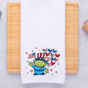 May include: A white ceramic mug with a black handle and the text "But First, Coffee" in a bold, black font. The mug is likely 310-425 ml and sits on a white surface. Ideal for a morning beverage.