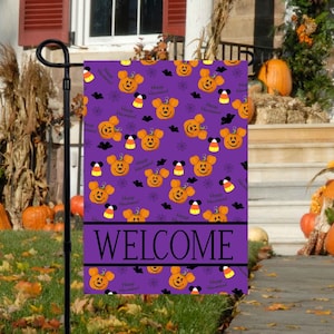 May include: Purple Halloween garden flag with a Mickey Mouse and pumpkin pattern. The flag says "Happy Halloween" and "Welcome".