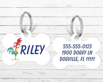 May include: White bone-shaped pet tag with a cartoon rooster illustration and the name "Riley" in navy blue. The tag includes contact information: phone number, address, and city.
