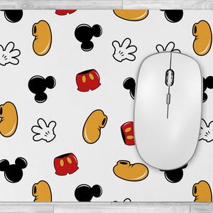 May include: White mouse pad with a repeating pattern of black and red Mickey Mouse characters, including ears, gloves, and shorts. The mouse pad is designed to be used with a computer mouse.