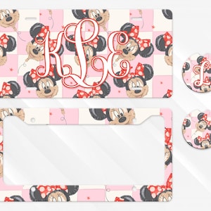 May include: A rectangular number plate, a number plate surround, and two circular car coasters featuring a repeating pattern of Minnie Mouse balloon heads on a light pink and white checkered background with a large red script monogram K L E.