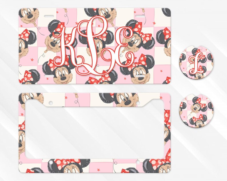 May include: A rectangular number plate, a number plate surround, and two circular car coasters featuring a repeating pattern of Minnie Mouse balloon heads on a light pink and white checkered background with a large red script monogram K L E.