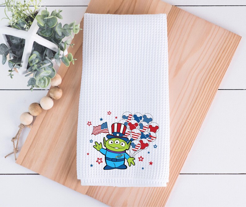 May include: A trio of cream-glazed ceramic mugs, each adorned with a hand-painted floral pattern in blue, green, and yellow hues. The mugs have a rounded form and a handle, ideal for enjoying a warm beverage.