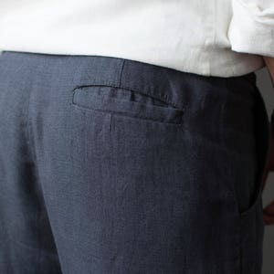 Close-up of back pocket on classic linen pants for men