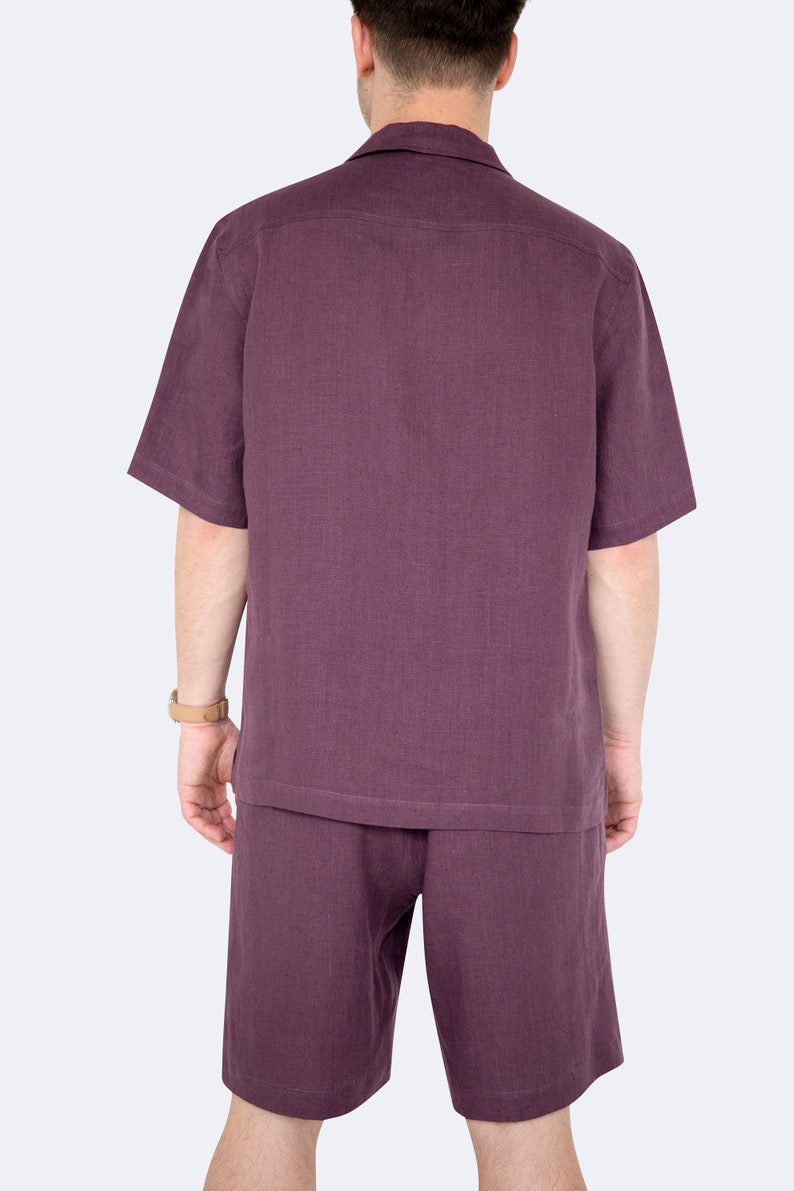 Model showing back of mens eggplant color linen shirt and shorts set