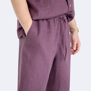 Close-up of drawstring waistband on mens eggplant color linen shorts